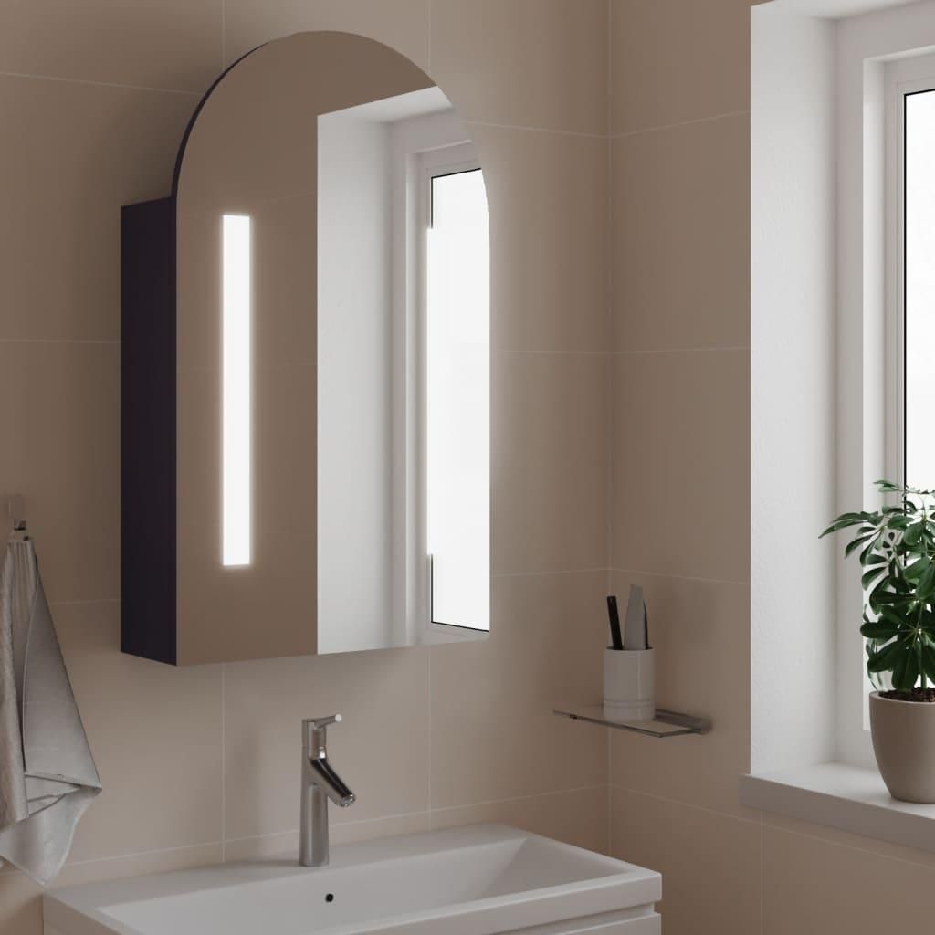 A bathroom vanity with a sink, faucet, and a mirrored cabinet with LED lighting.