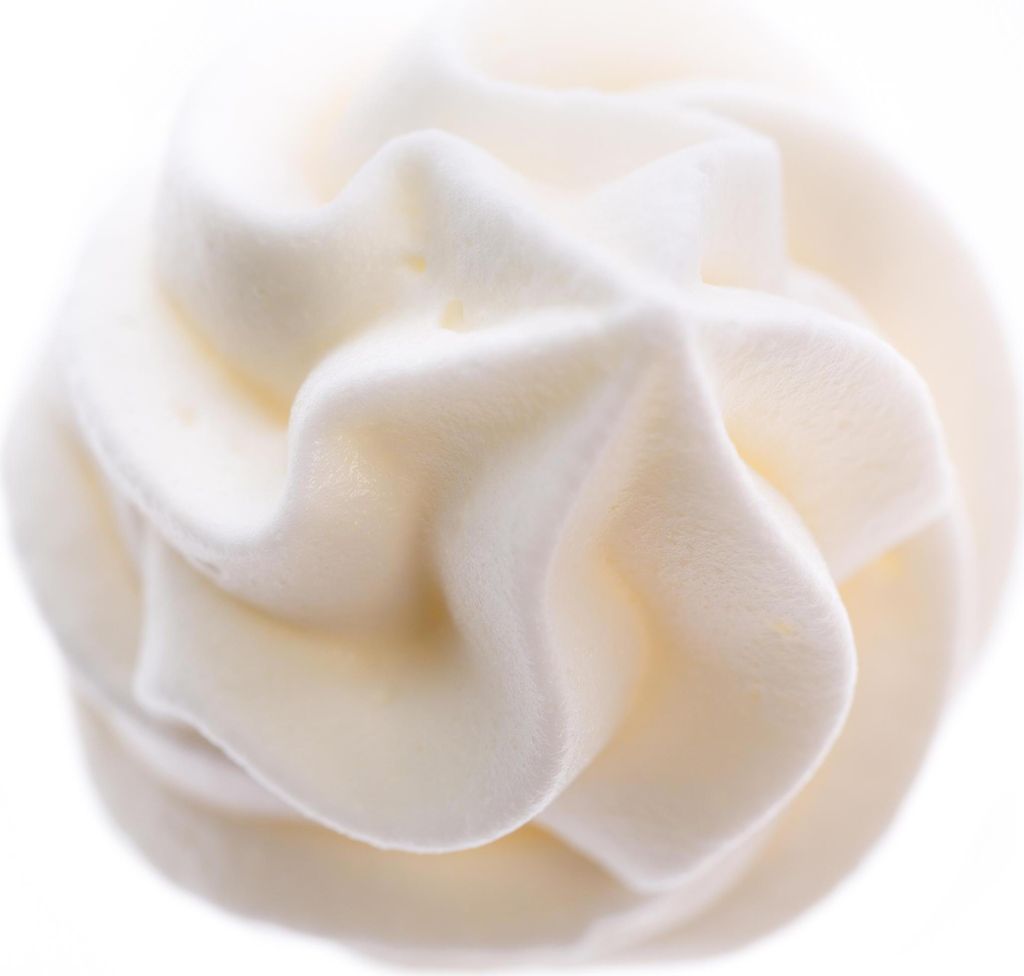 A close-up, studio shot of whipped cream.