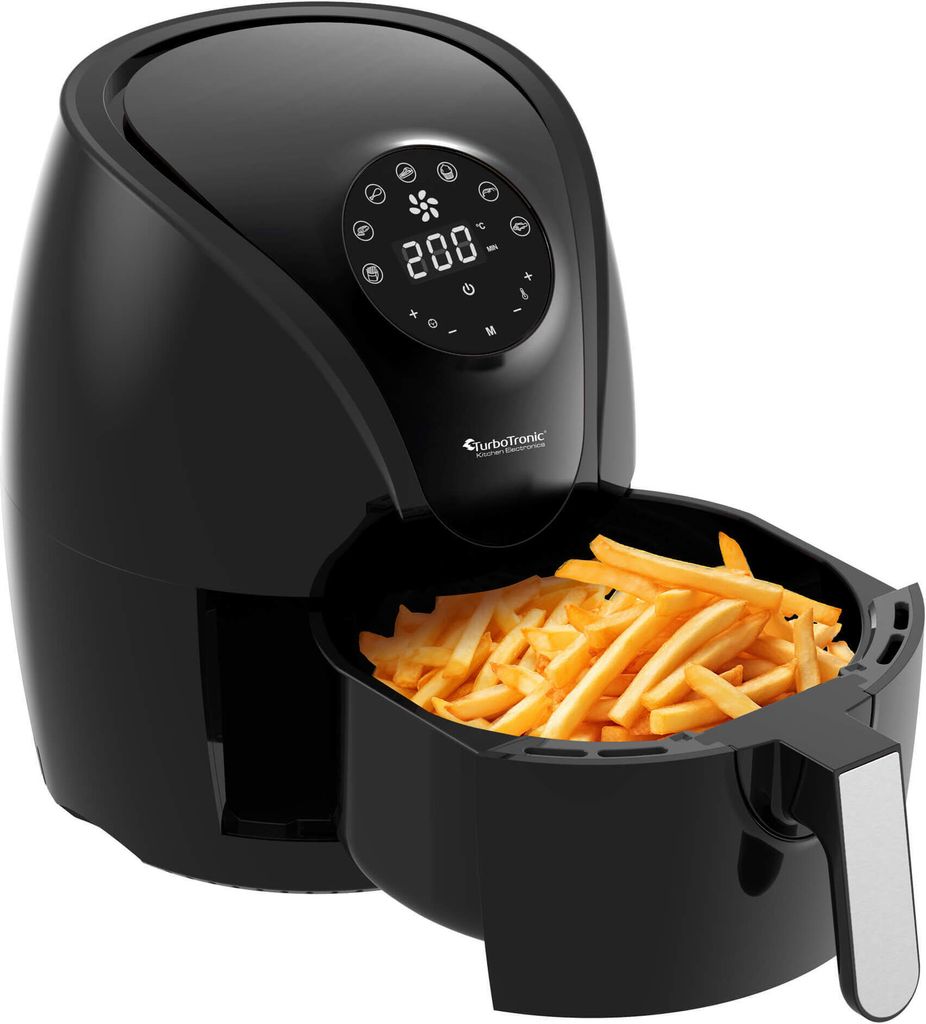 A black air fryer filled with french fries, shown on a white background.