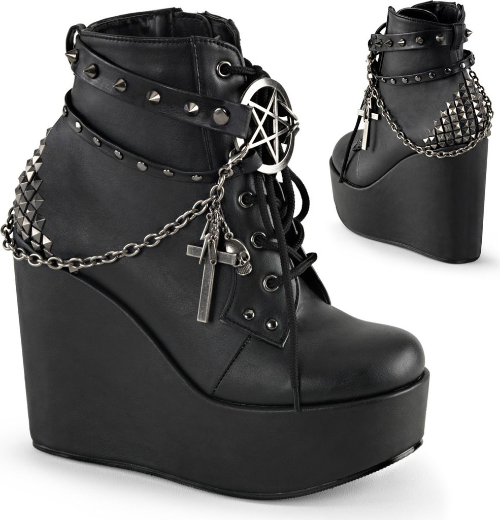 A pair of black platform wedge boots with gothic-style embellishments.