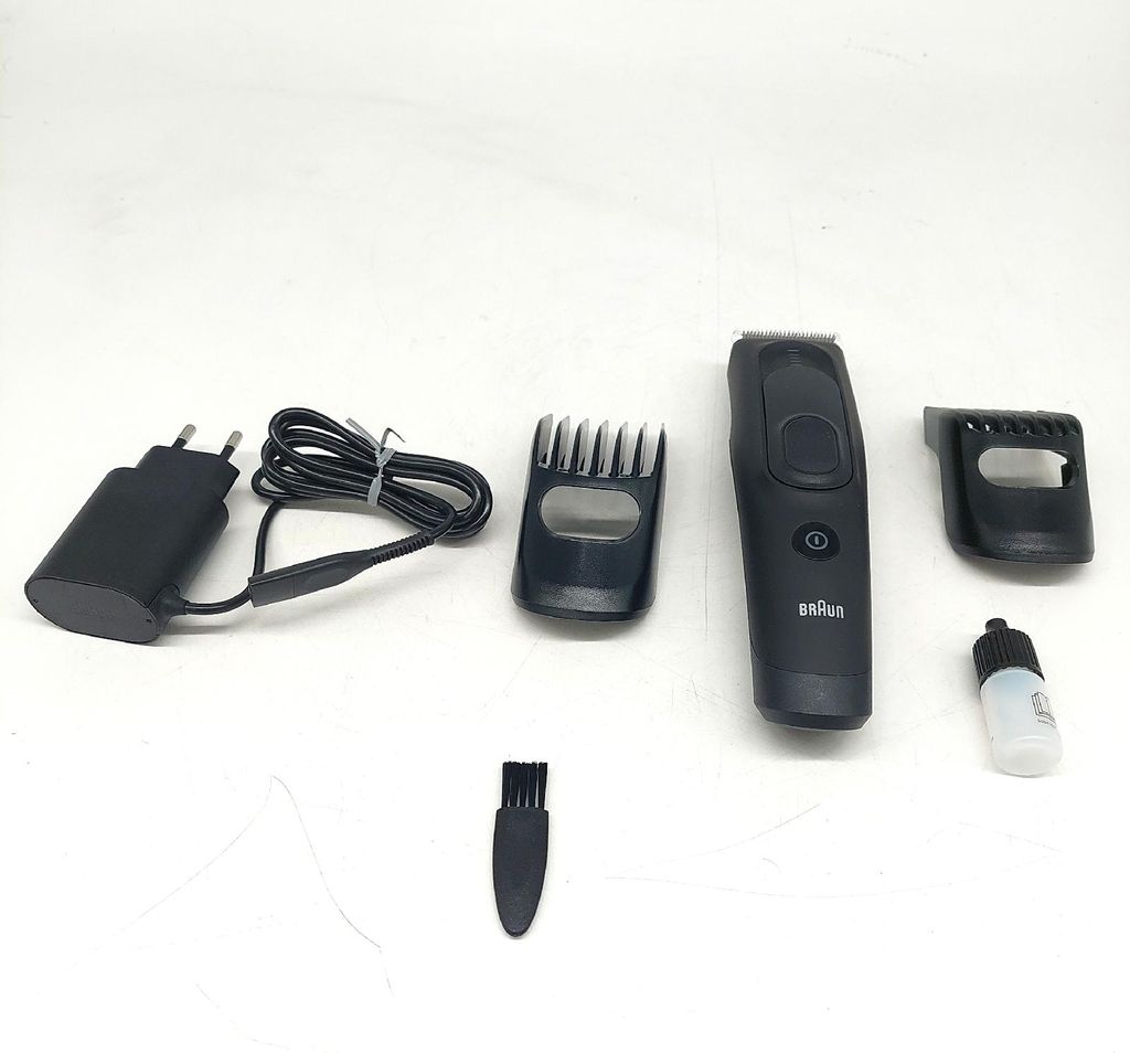 A collection of Braun hair trimmer accessories laid out on a white background.