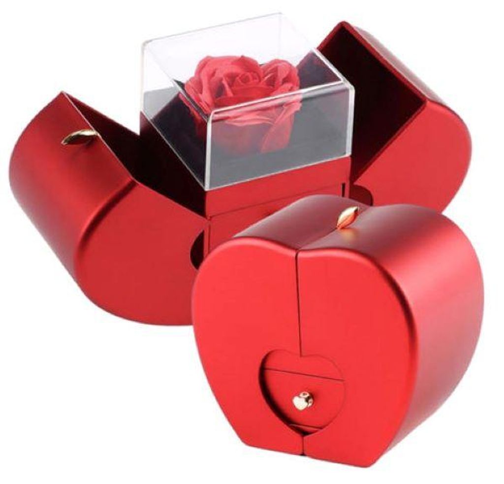 Rote apfelförmige Geschenkbox, teilweise geöffnet, mit einer roten konservierten Rose in einer durchsichtigen Hülle und einer kleinen herzförmigen Schublade