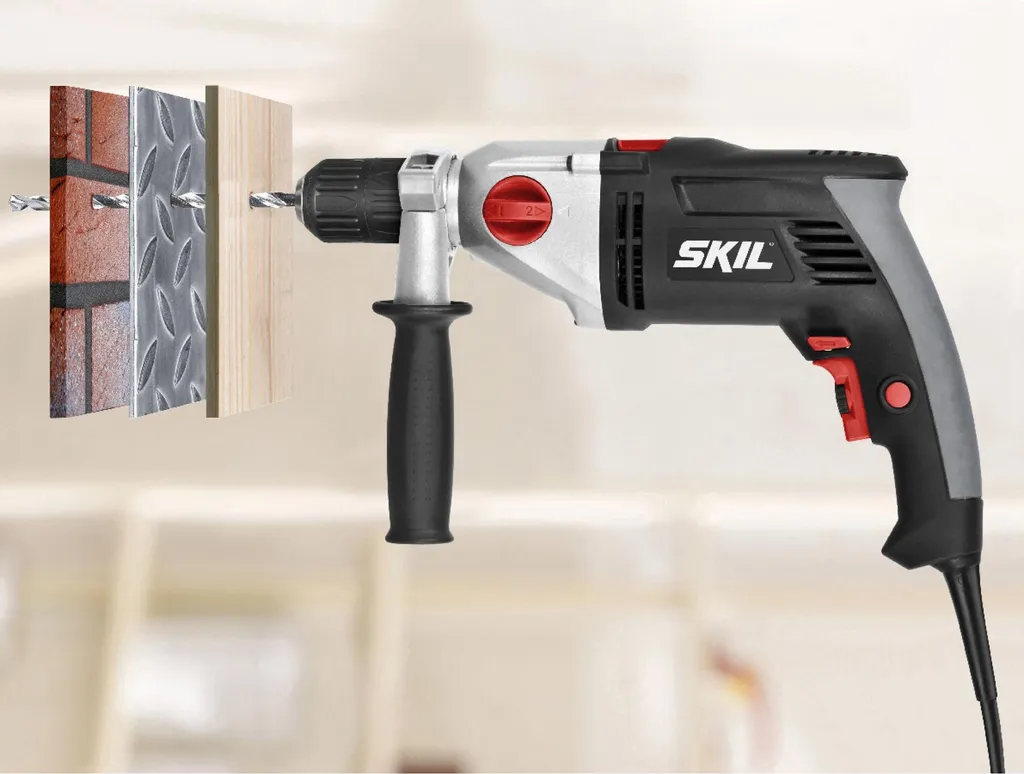 Perceuse filaire à percussion 900W SKIL avec set d'accessoires complet