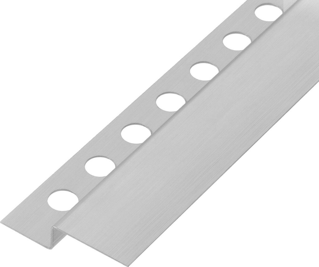 A close-up, angled view of a metal trim piece with circular holes.