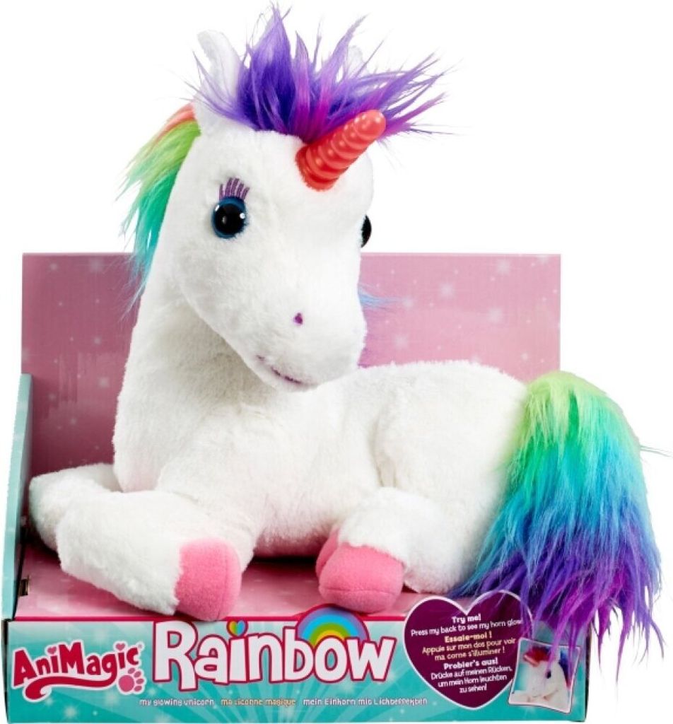 A plush unicorn toy is presented in its packaging, which features a pink background with subtle star patterns.