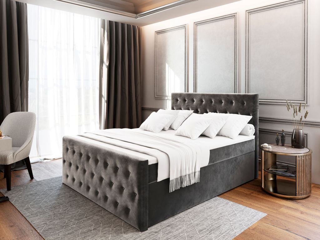 A bedroom scene with a large upholstered bed.