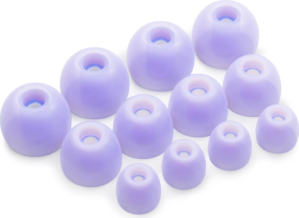 A collection of purple silicone earbud tips arranged on a white background.