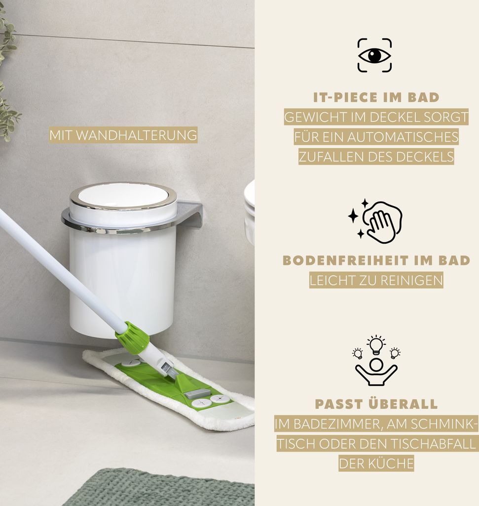 A bathroom scene showing a white trash can mounted on a wall with a mop cleaning the floor.
