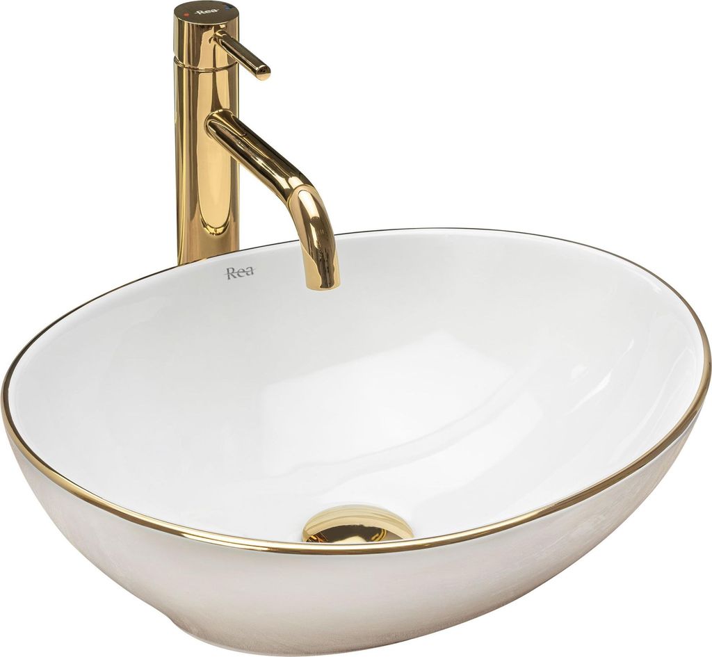 A white oval basin with a gold rim and a gold faucet.