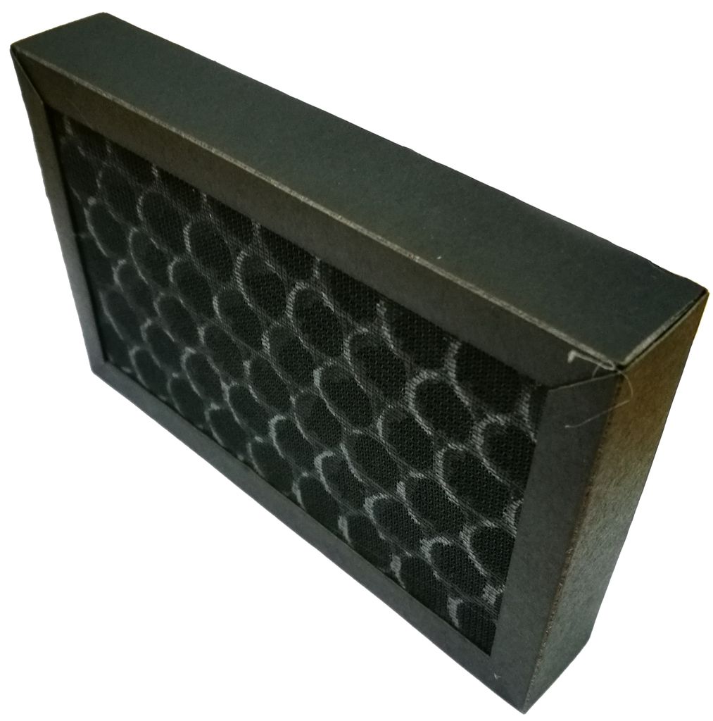 A close-up, angled view of a black air filter with a honeycomb pattern, set against a white background.