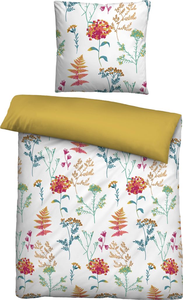 A flat lay of a duvet cover and pillowcase with a floral pattern, and a solid yellow pillow.