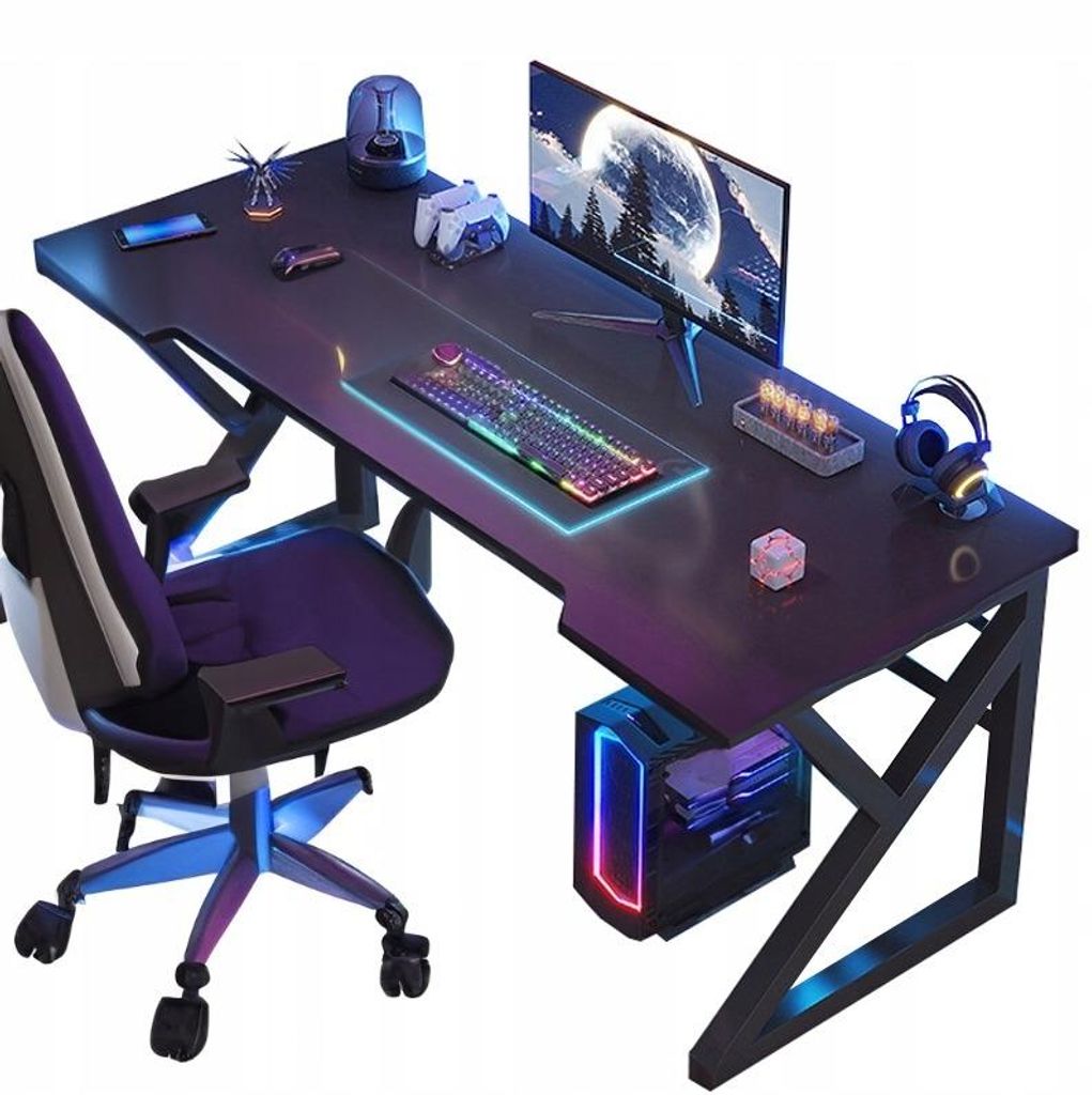 A gaming desk setup with a chair, computer, monitor, keyboard, and accessories.