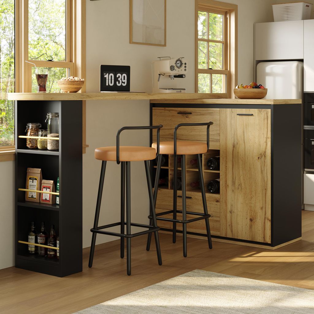 A modern kitchen or dining area with a bar counter, stools, and storage units.