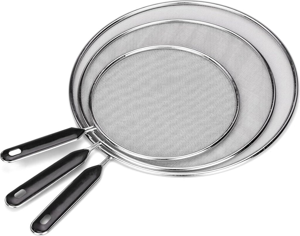Three stainless steel splatter screens with black handles are arranged diagonally on a white background.
