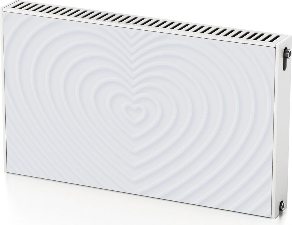 A white radiator cover with a raised heart pattern and ventilation slots at the top.