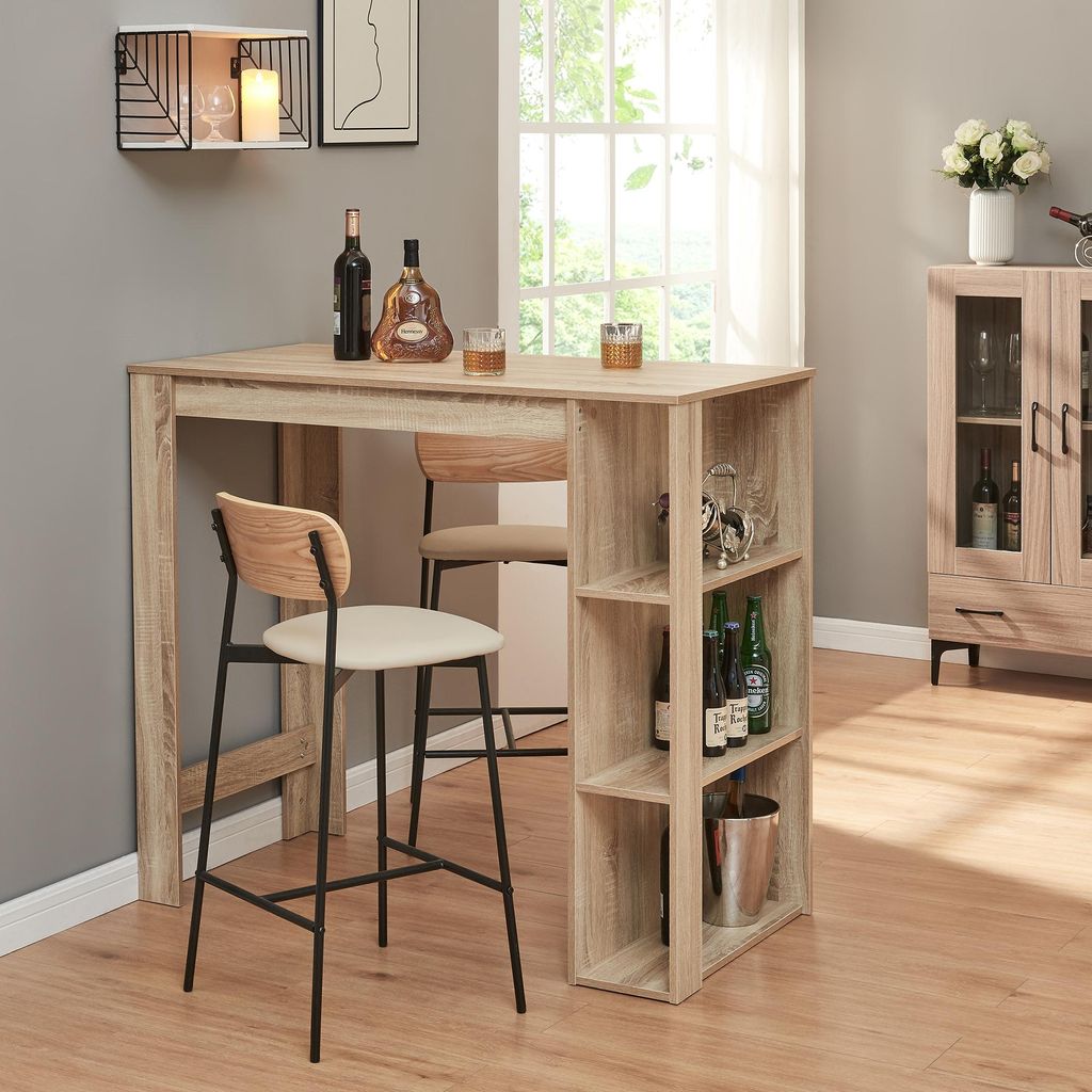 A bar table with stools in a room setting, with a cabinet in the background.