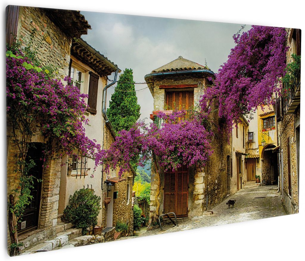 Wallario Premium Leinwandbild Malerische Stadt in der Provence mit bunten Blumen in Größe 60 x 90 cm