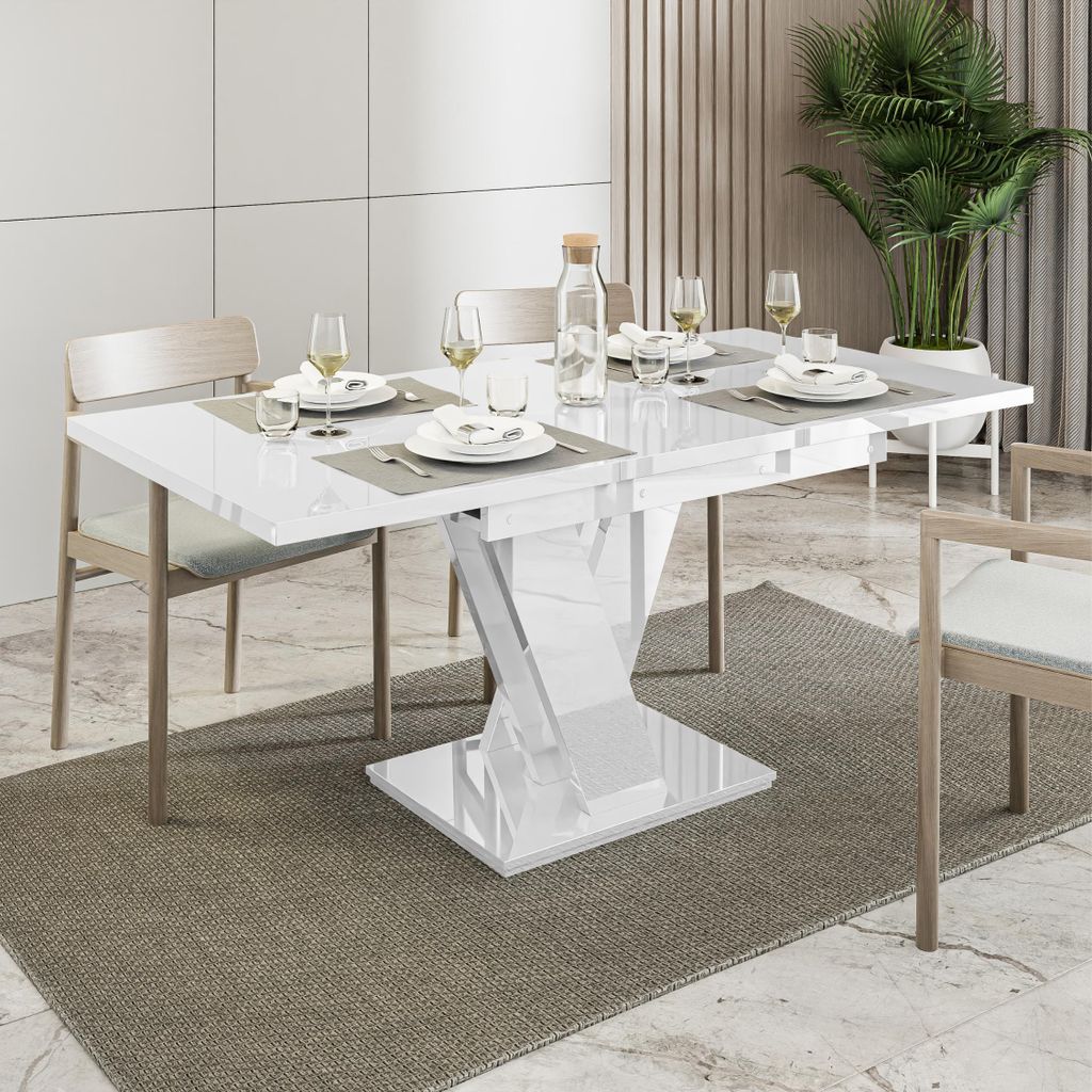 A dining table set up for a meal in a modern dining room.
