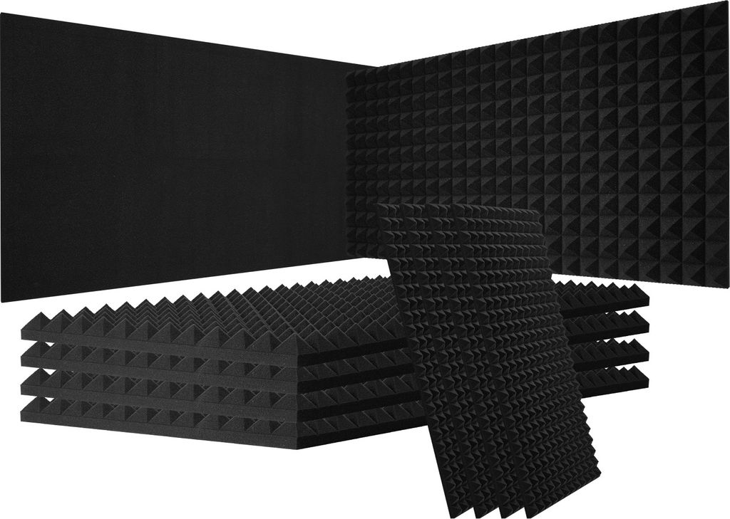 A collection of black acoustic foam panels with a pyramid texture, stacked and arranged in a corner.