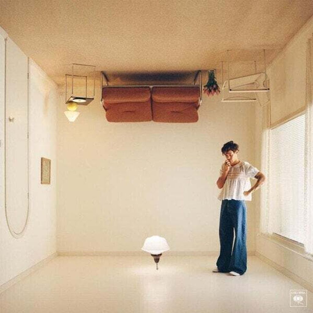 An upside-down room with a person standing in it.