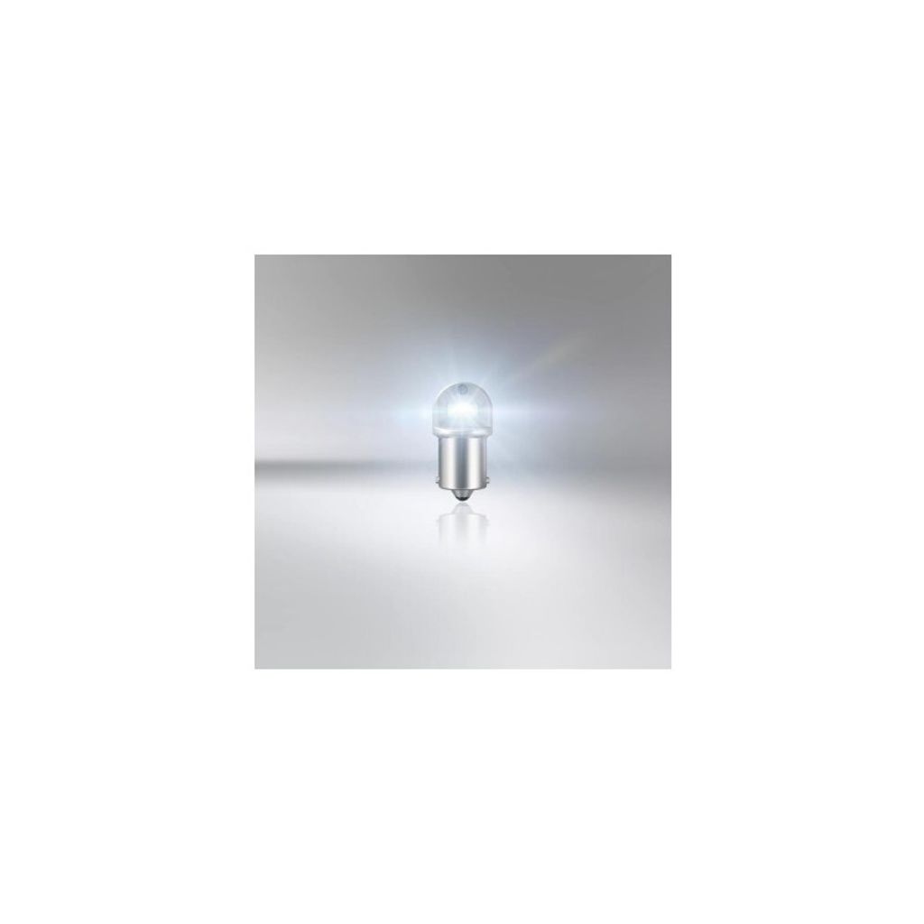 A single light bulb is shown on a reflective surface with a gradient background.