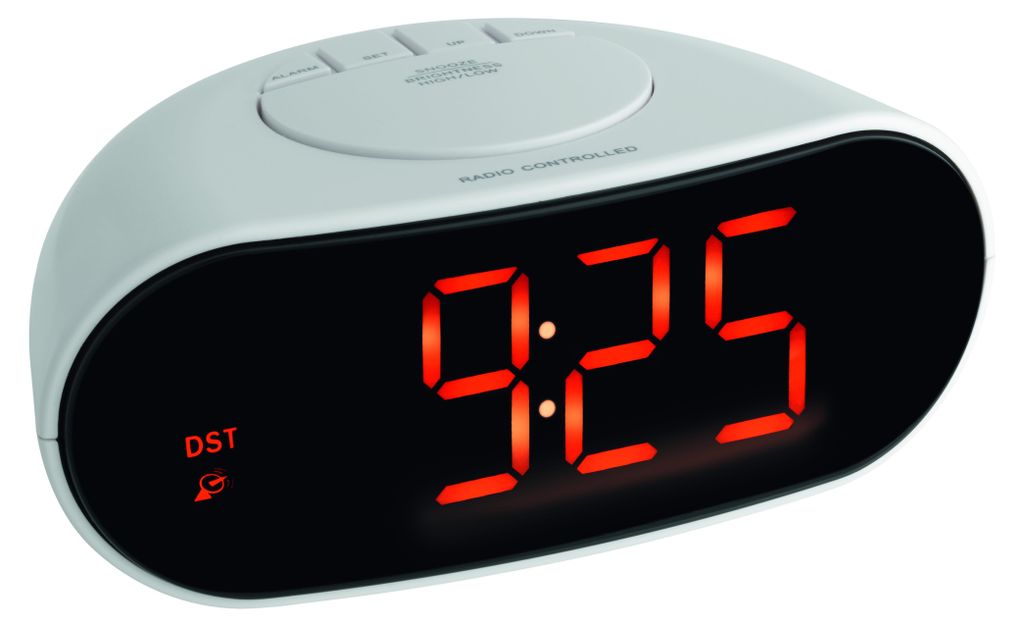 A digital alarm clock with a red LED display.