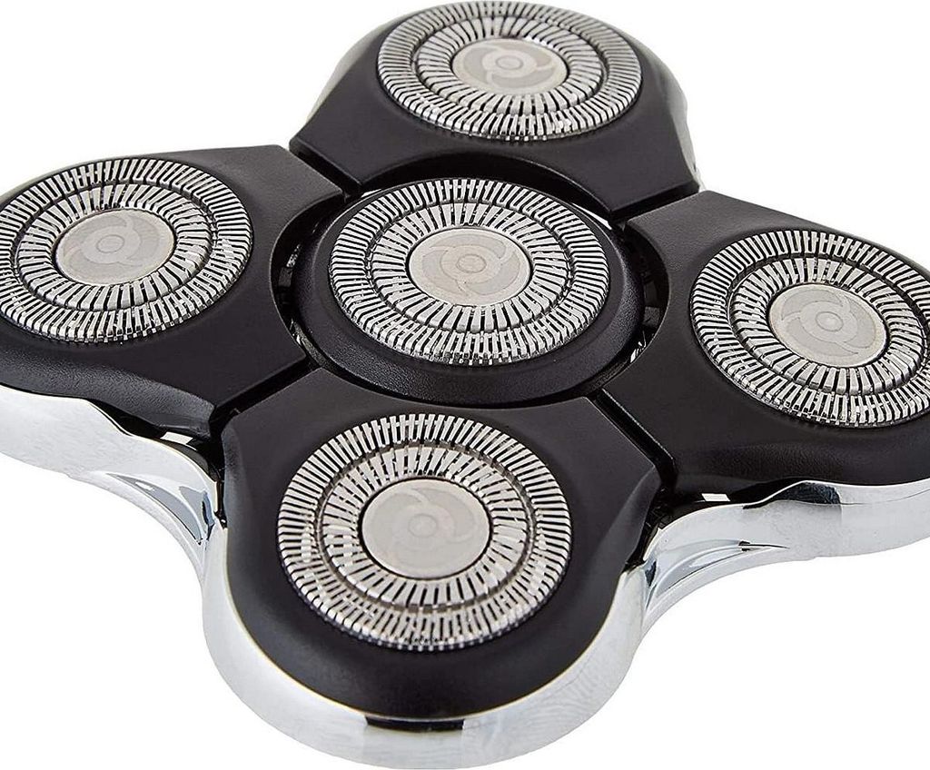 A close-up view of a shaver head with multiple rotary blades.