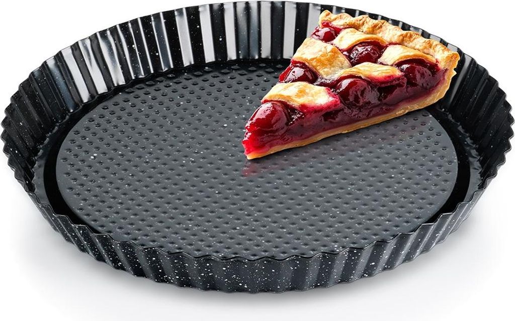 A slice of cherry pie sits in a fluted tart pan.
