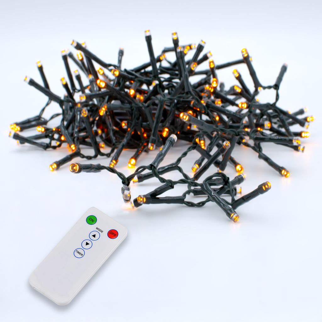 A pile of LED string lights with a remote control.
