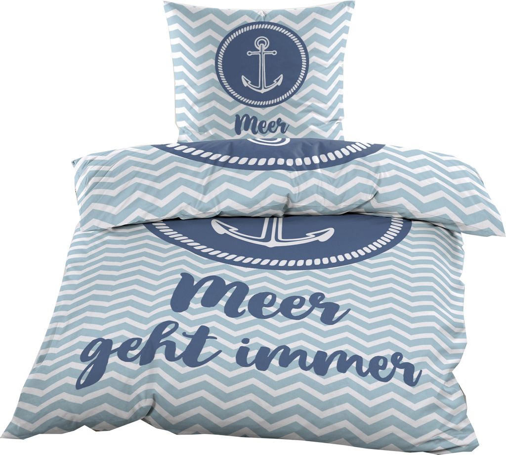 A folded duvet cover and pillowcase set with a nautical theme.
