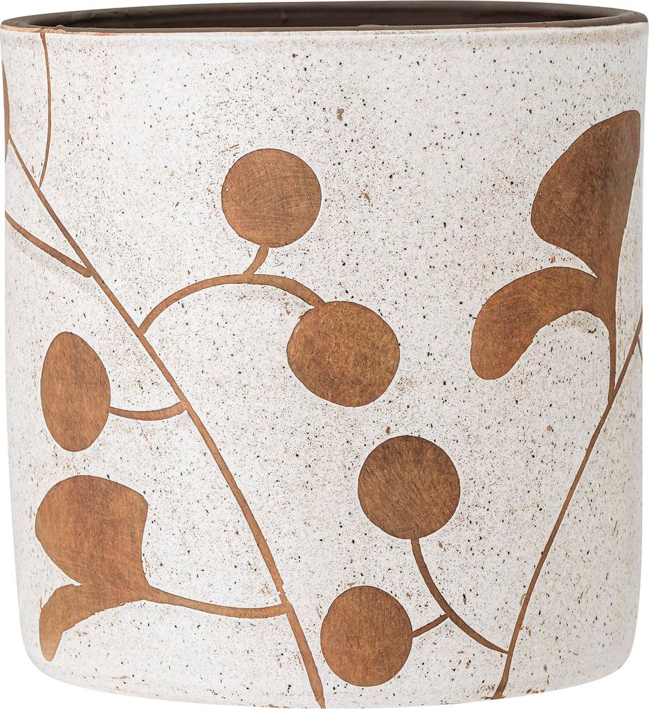 A close-up view of a decorative planter with a speckled white base and a brown botanical pattern.