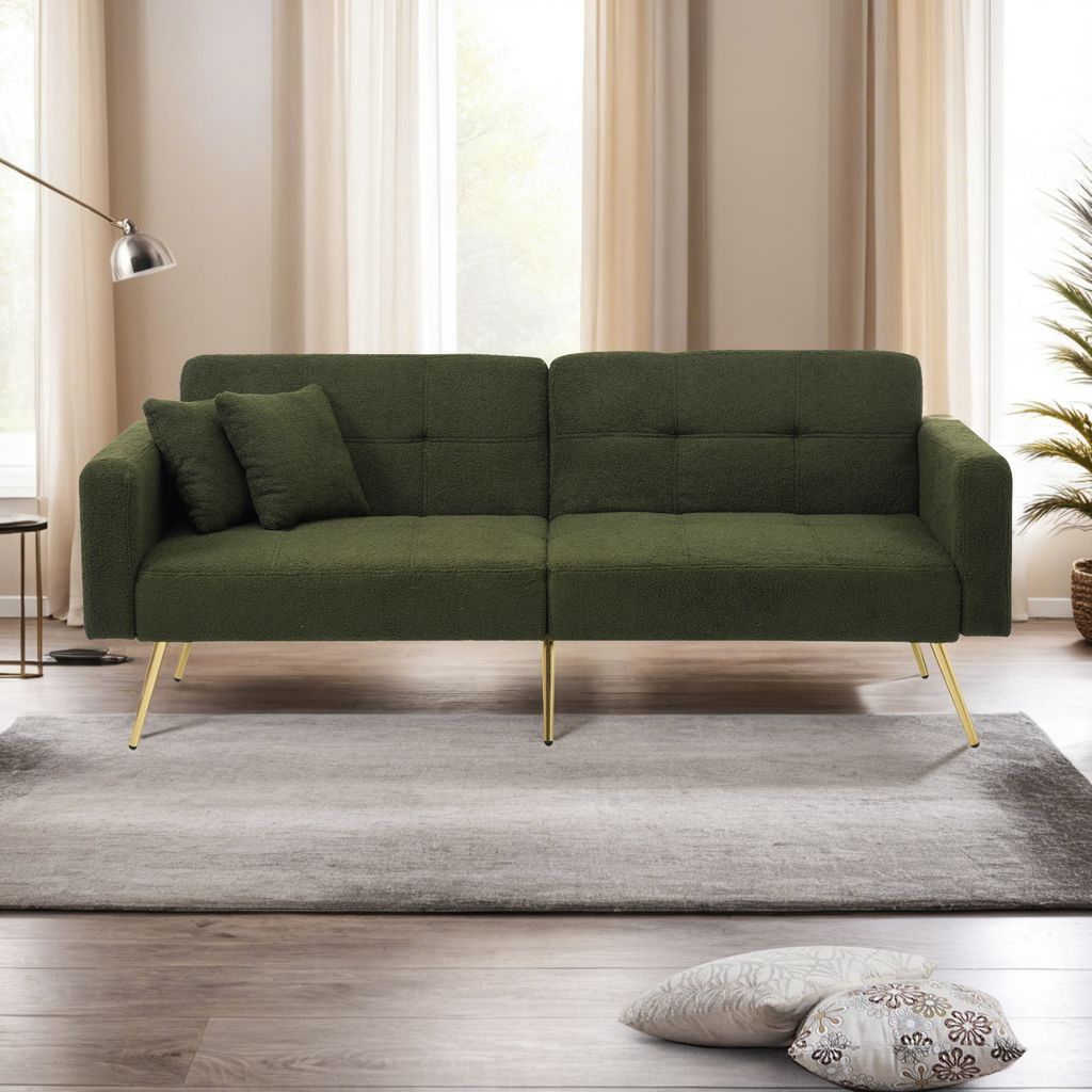 A green sofa bed with gold legs is shown in a living room setting.