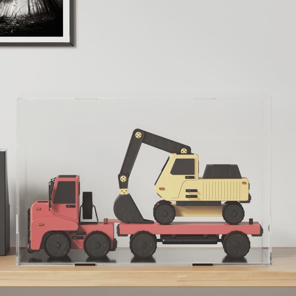 A toy truck carrying a toy excavator inside a transparent display box.