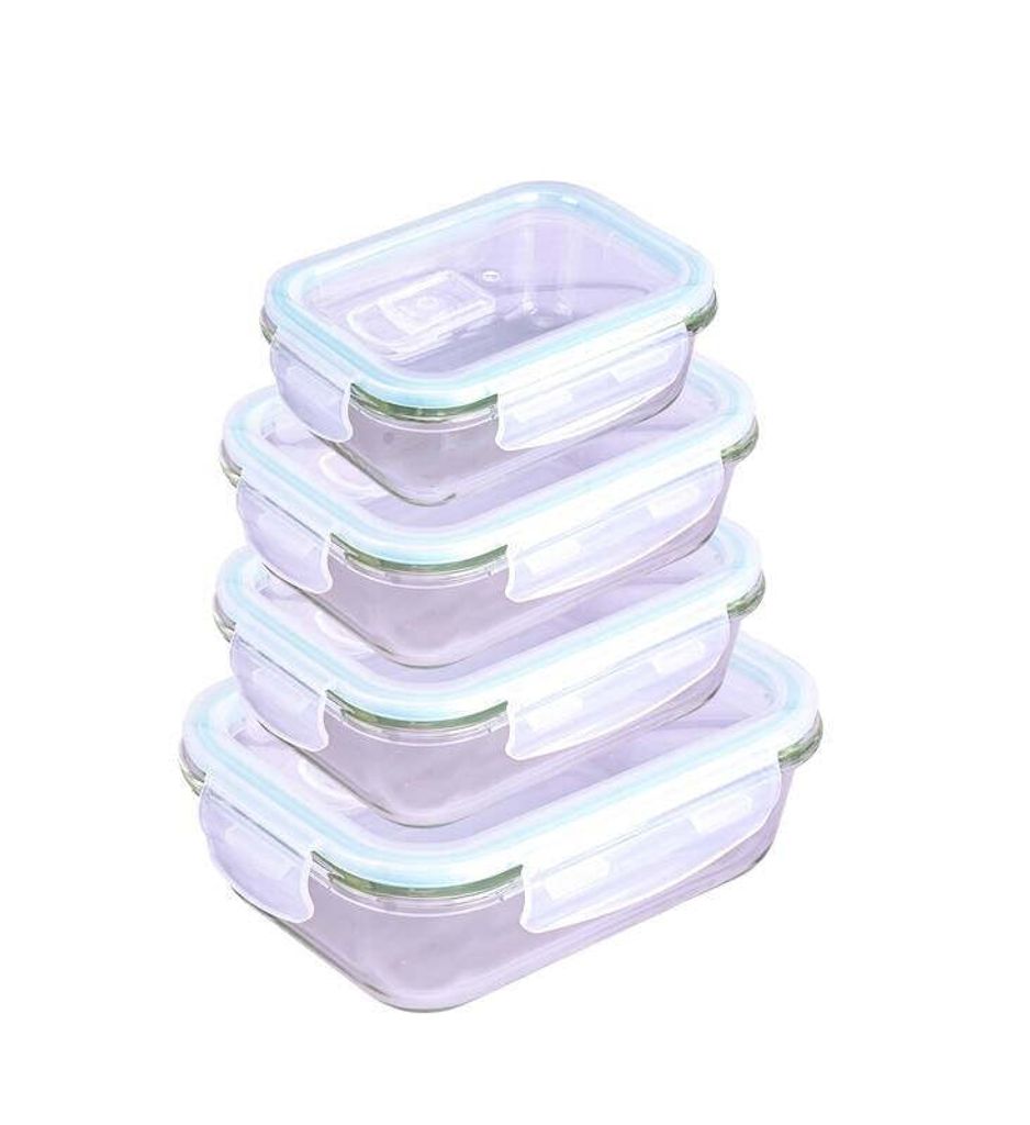 A stack of four rectangular glass food storage containers with light blue lids.