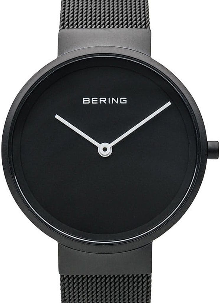 A close-up studio shot of a black Bering watch with a mesh band.
