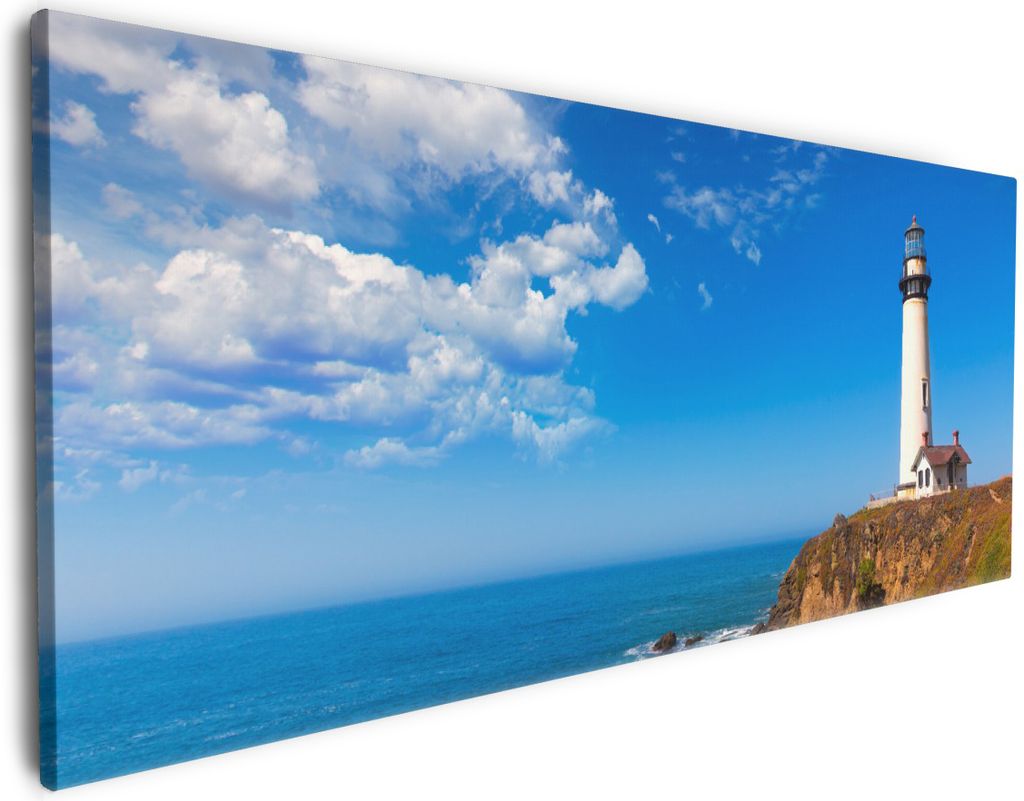 Wallario Premium Leinwandbild Leuchtturm auf einem Felsvorsprung - Blauer Himmel in Größe 50 x 125 cm