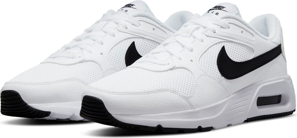 A pair of white Nike Air Max Sc sneakers with black accents.