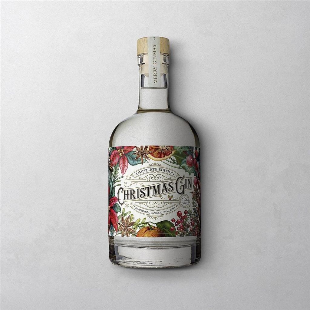 A bottle of Christmas Gin with a festive label, placed on a light gray and white background.
