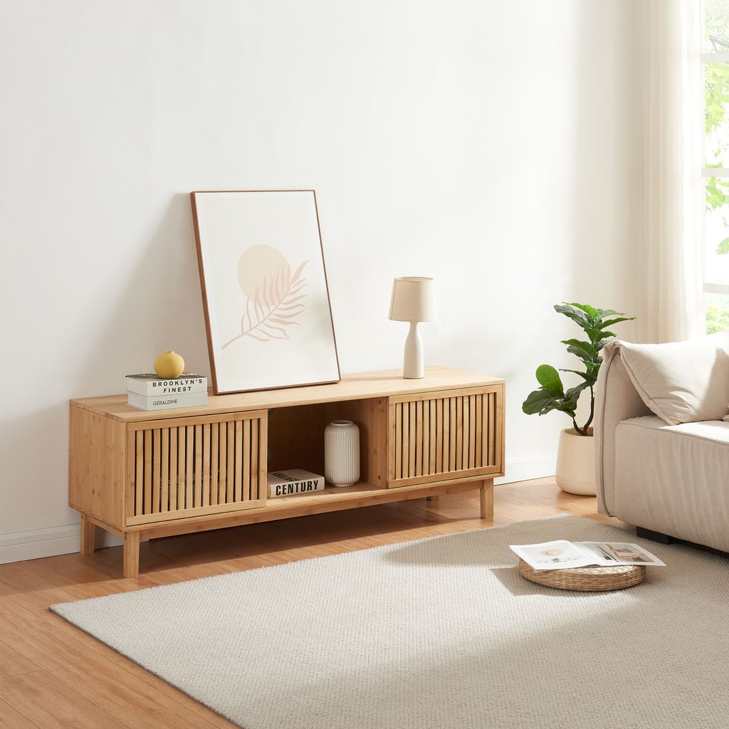 A modern living room with a wooden TV stand, a sofa, and a rug.