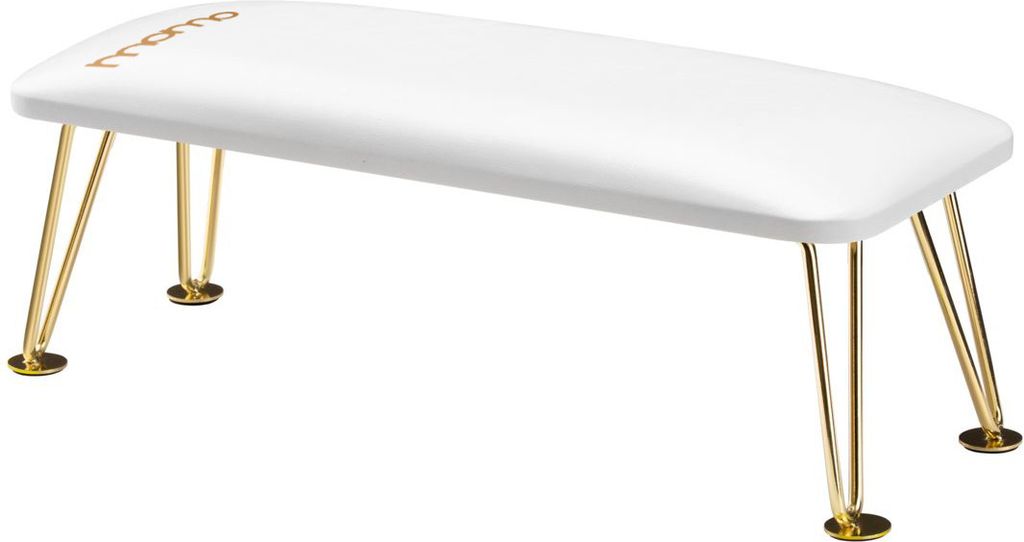 A white manicure mat with gold legs.