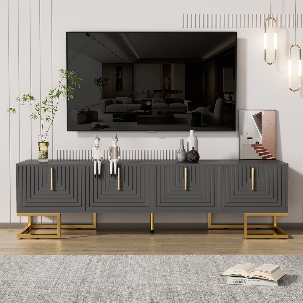 A modern living room setup featuring a TV stand with a television mounted above it.