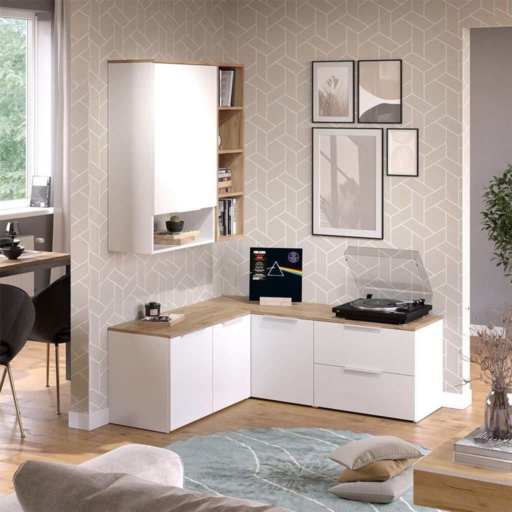 A modern living room with a wall-mounted media unit, a turntable, and decorative items.