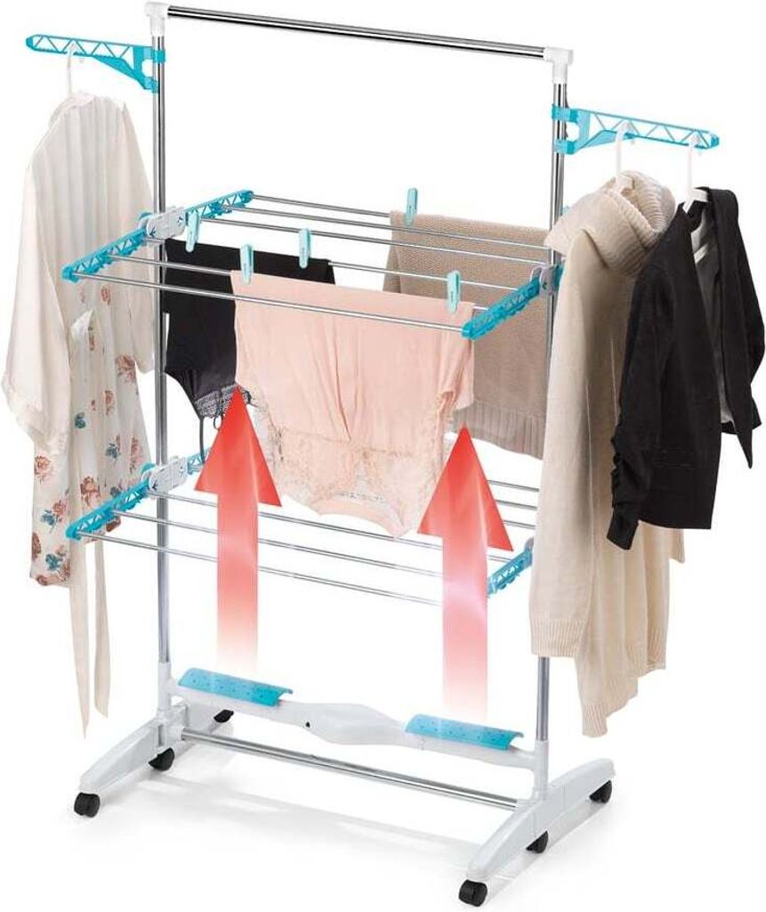 A multi-tiered electric clothes drying rack with clothes hanging on it. Red arrows indicate airflow.