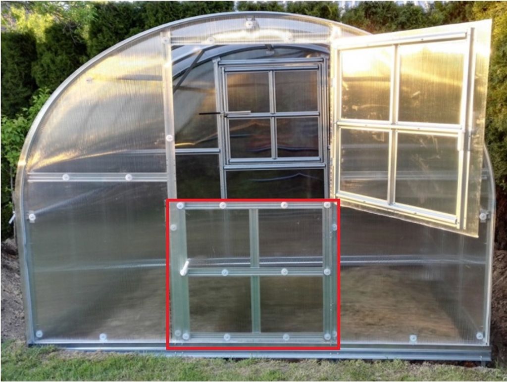 A greenhouse with a red-highlighted window section.
