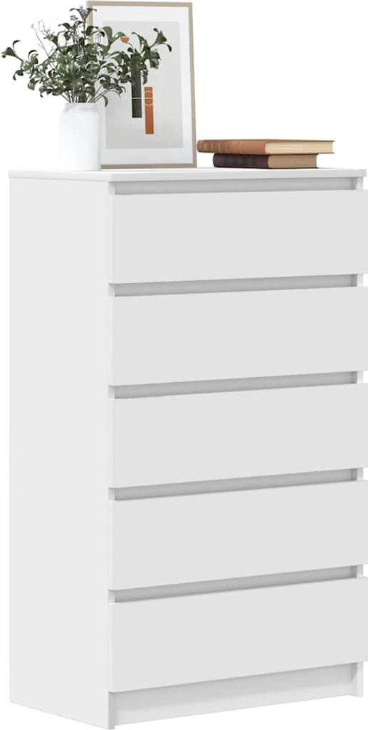 A white chest of drawers with a plant and books on top.