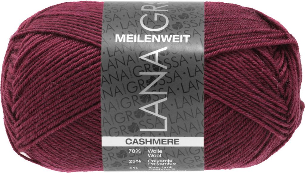 A ball of burgundy yarn with a label on it.