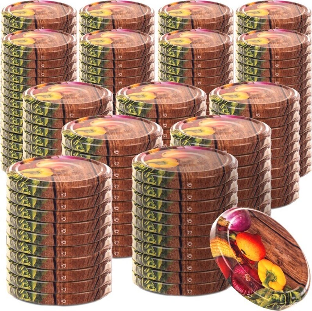 A stack of round metal lids with a wood grain and vegetable pattern, with one lid in the foreground showing a close-up of the pattern.