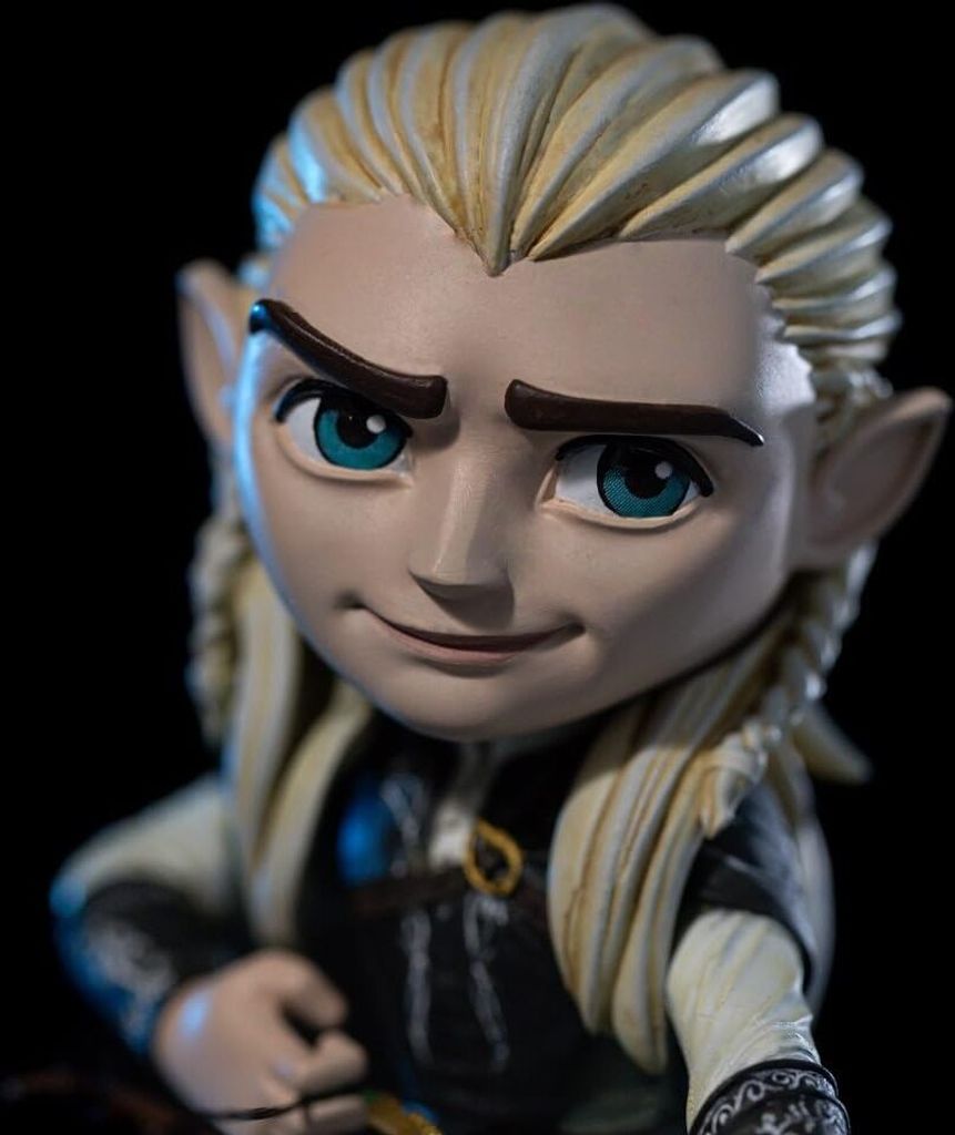 A close-up of a stylized figurine of the character Legolas from The Lord of the Rings.