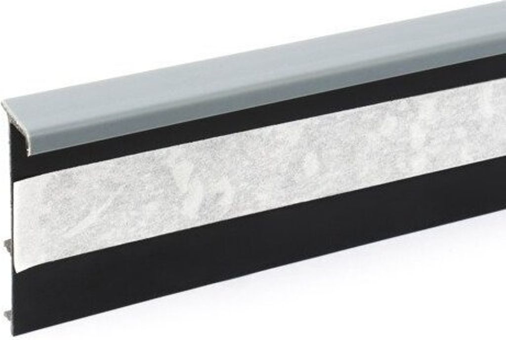 A close-up, straight-on view of a carpet trim or threshold strip.