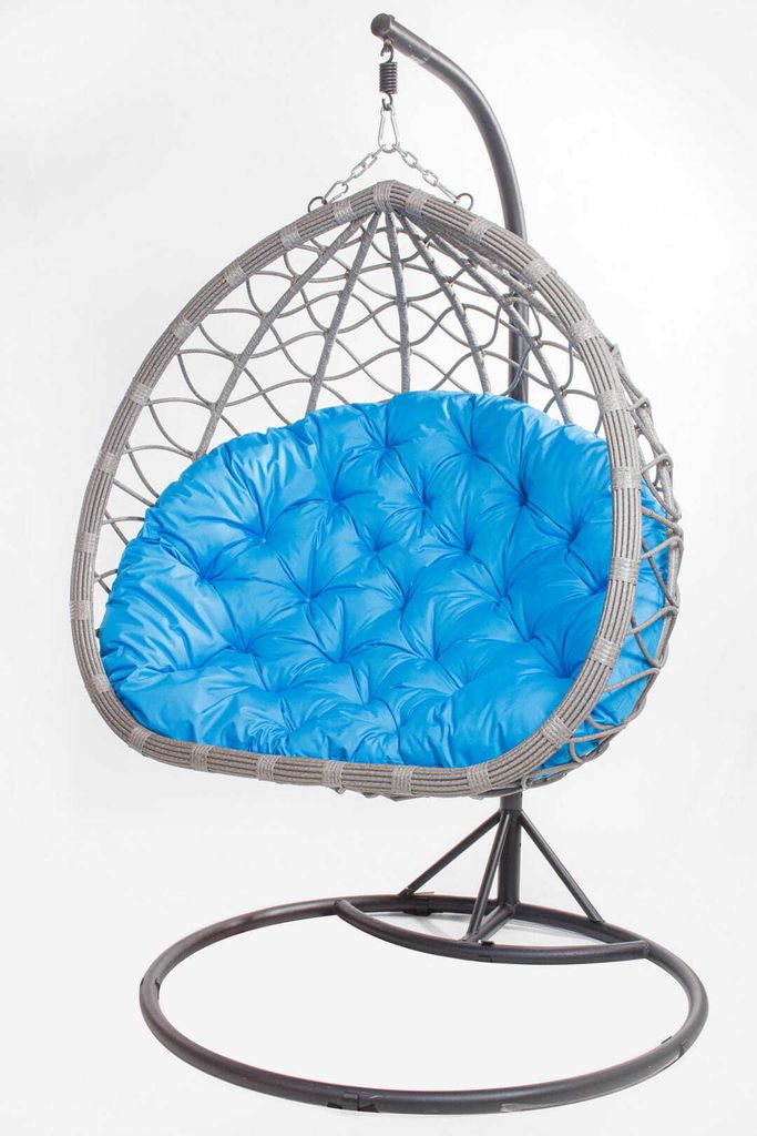 A hanging egg chair with a blue cushion, shown against a white background.